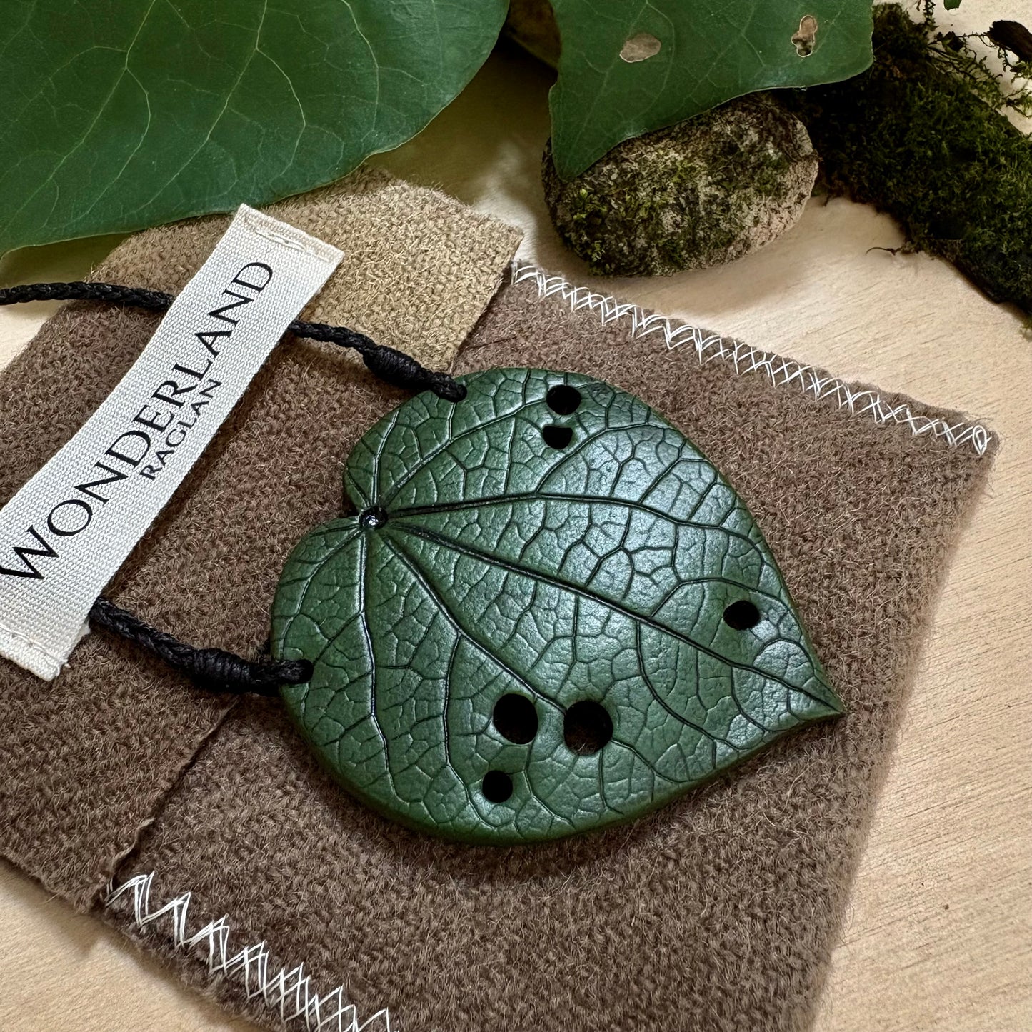 Kawakawa Necklace Large 6cm.  On black cord