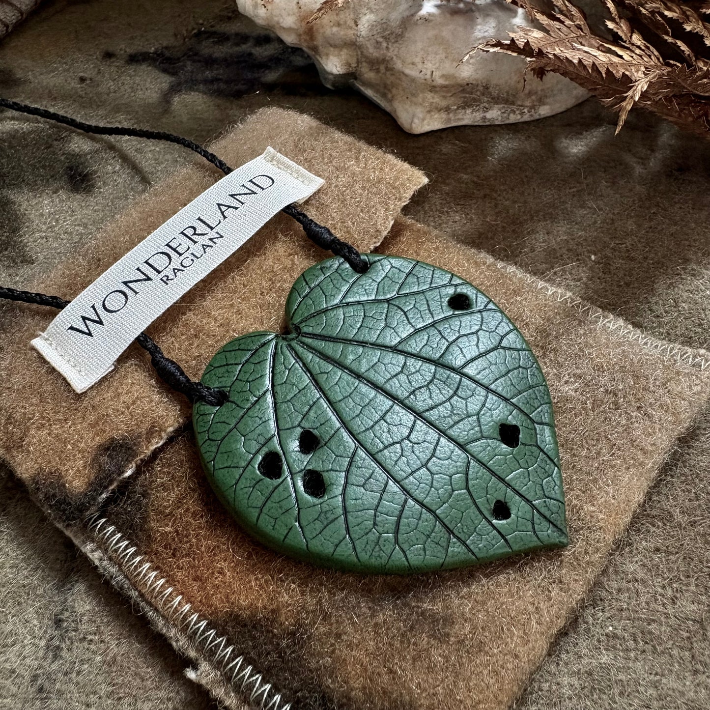 Kawakawa Necklace Large 6cm.  On black cord