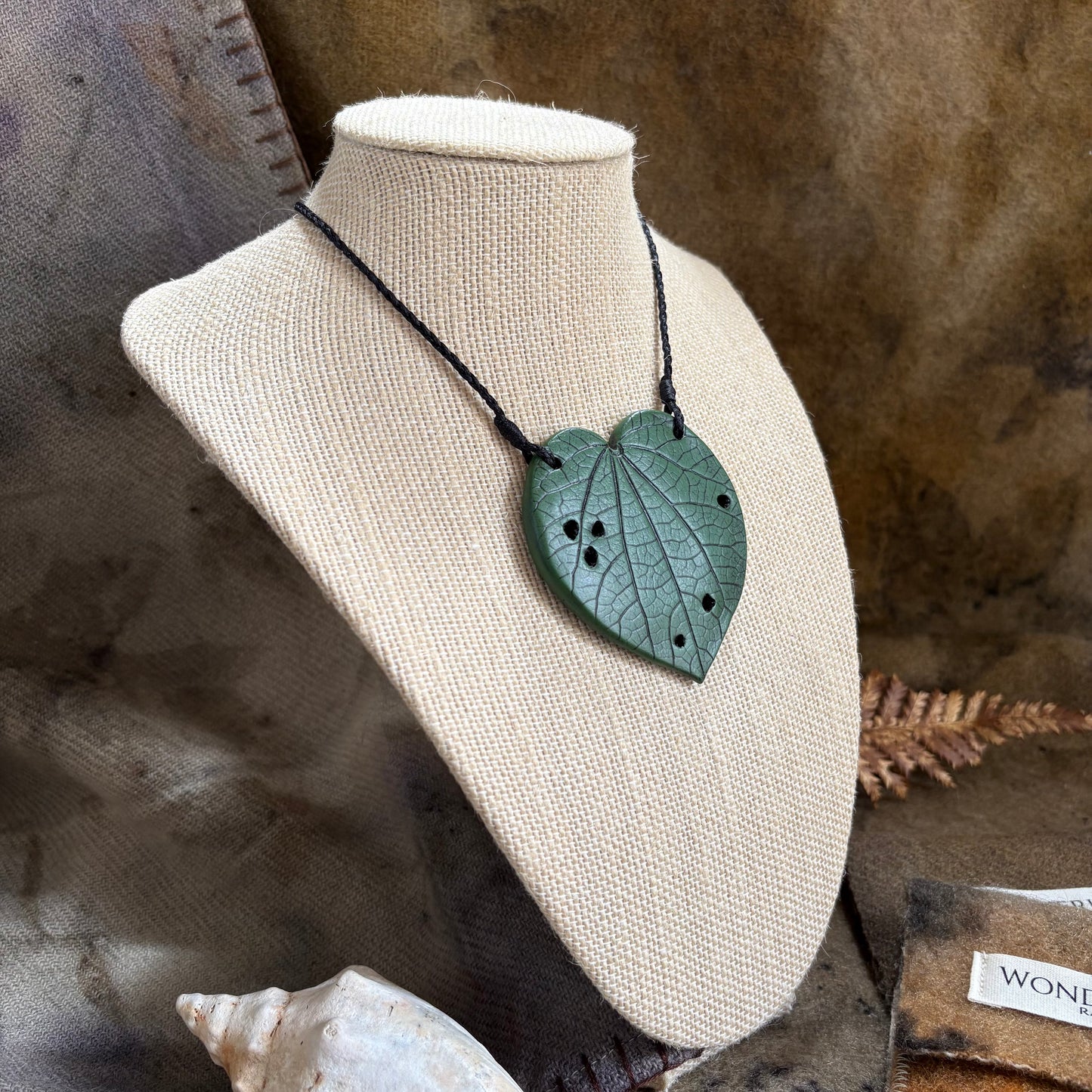 Kawakawa Necklace Large 6cm.  On black cord