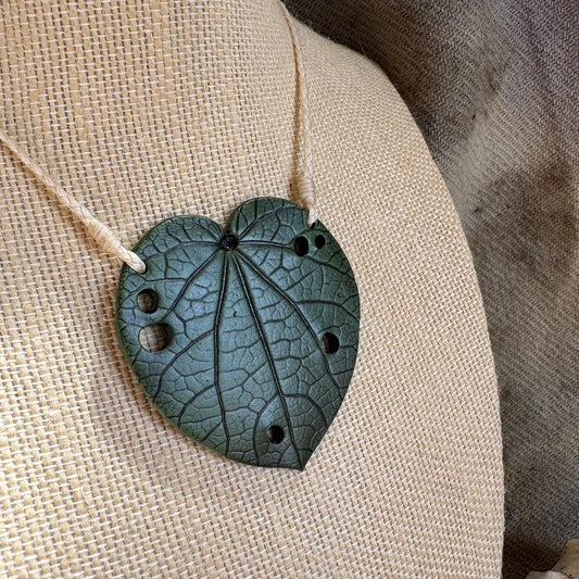Kawakawa Necklace Large 6cm.  On cream cord